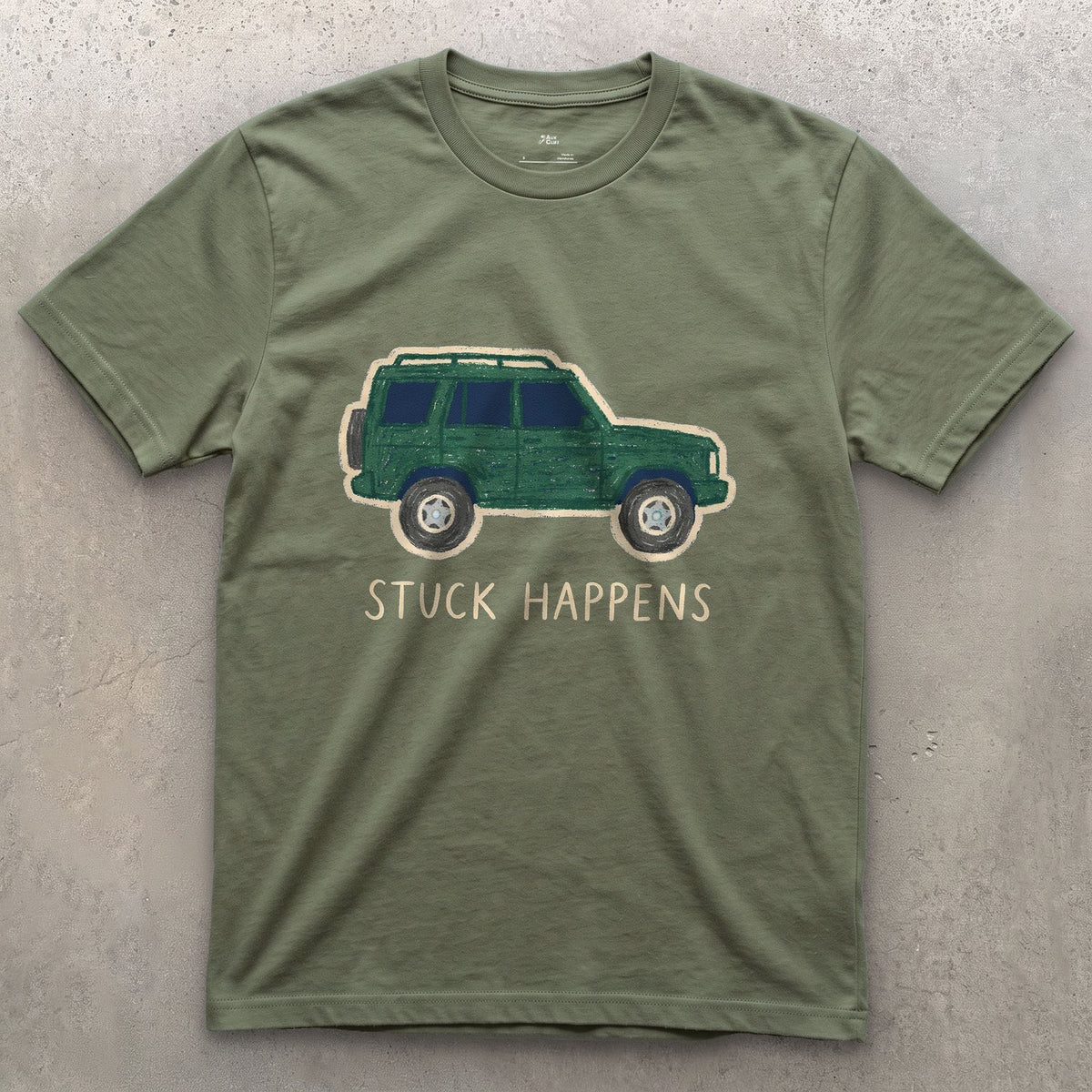 Stuck Happens, Green Wagon in Profile design on a Military Green Gildan Softstyle t-shirt
