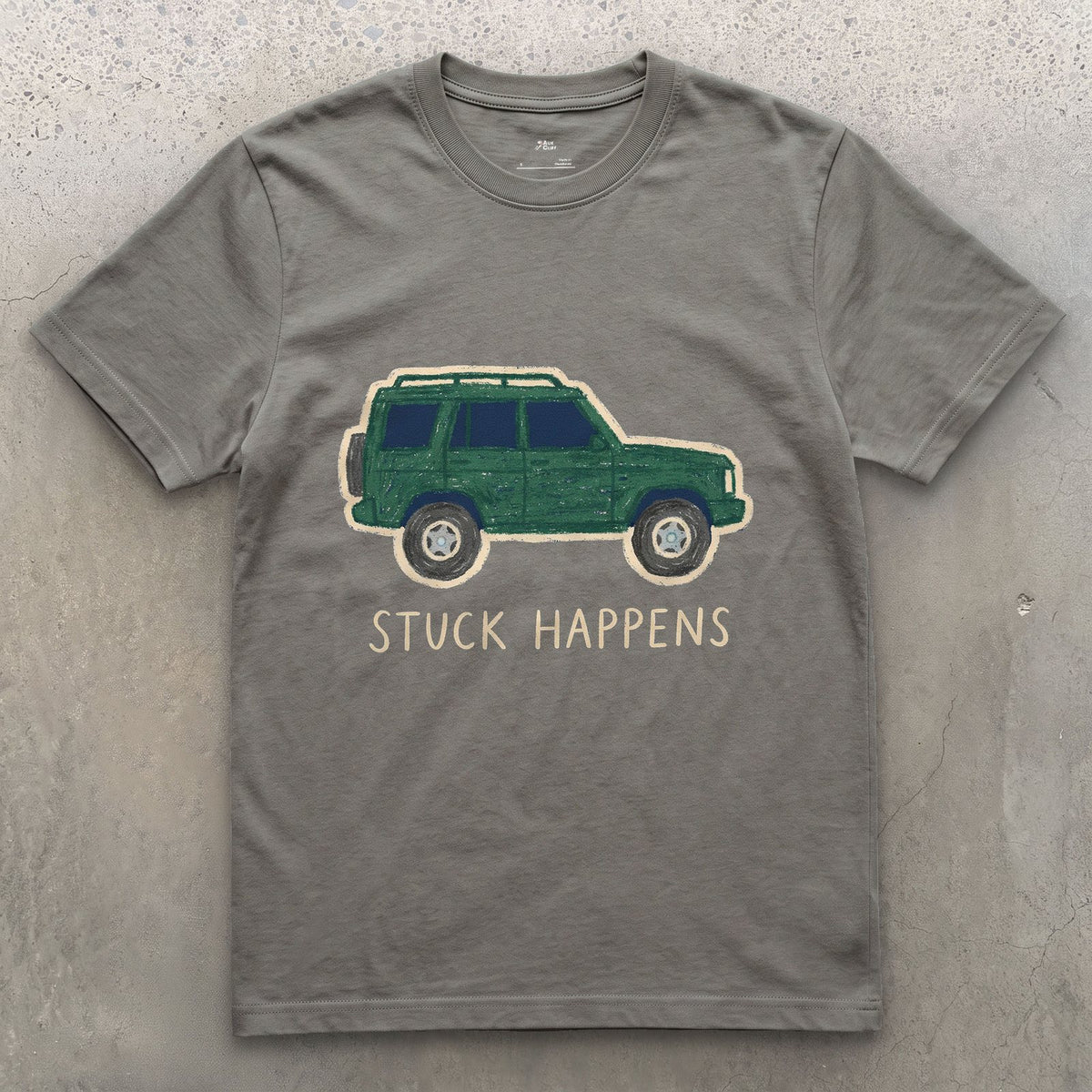 Stuck Happens, Green Wagon in Profile design on a Charcoal Gildan Softstyle t-shirt