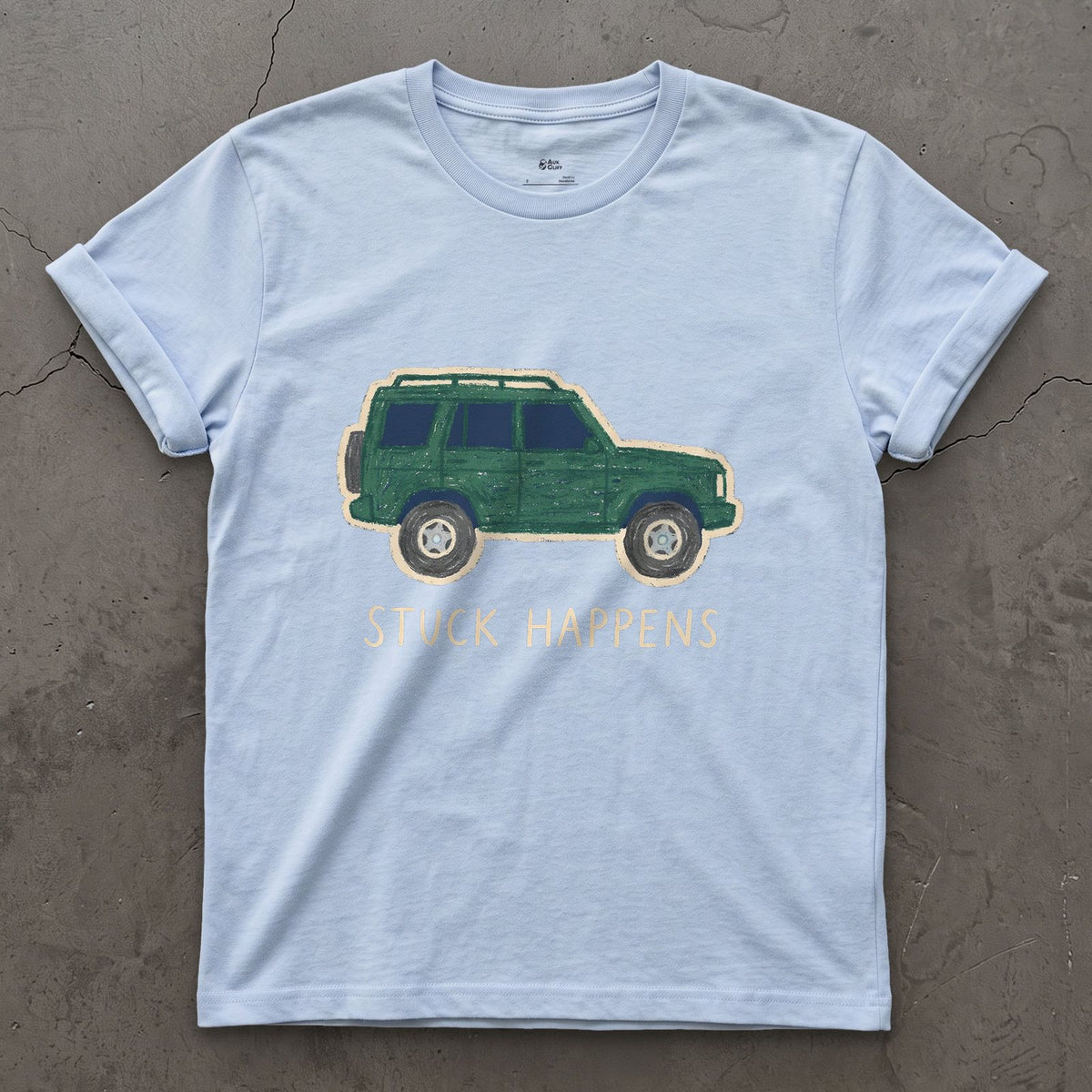 Stuck Happens, Green Wagon in Profile design on a Light Blue Gildan Softstyle t-shirt