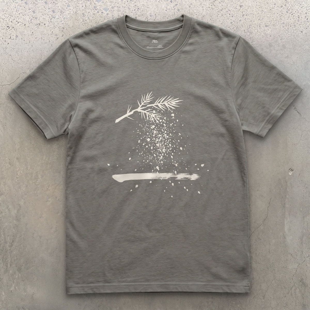 The Branch Drops Its Snow design on a Charcoal Gildan Softstyle t-shirt