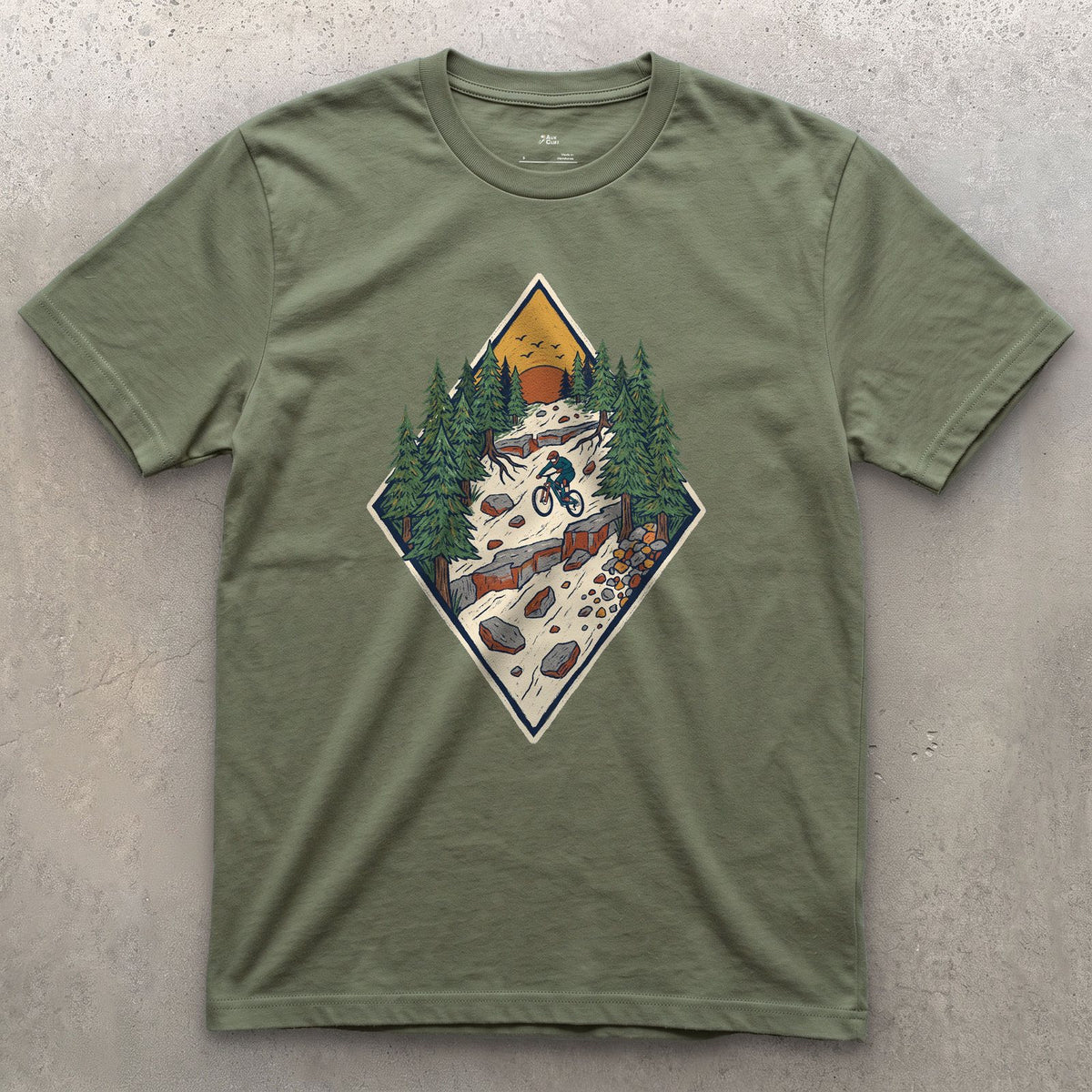 The Chute Behind the Diamond design on a Military Green Gildan Softstyle t-shirt