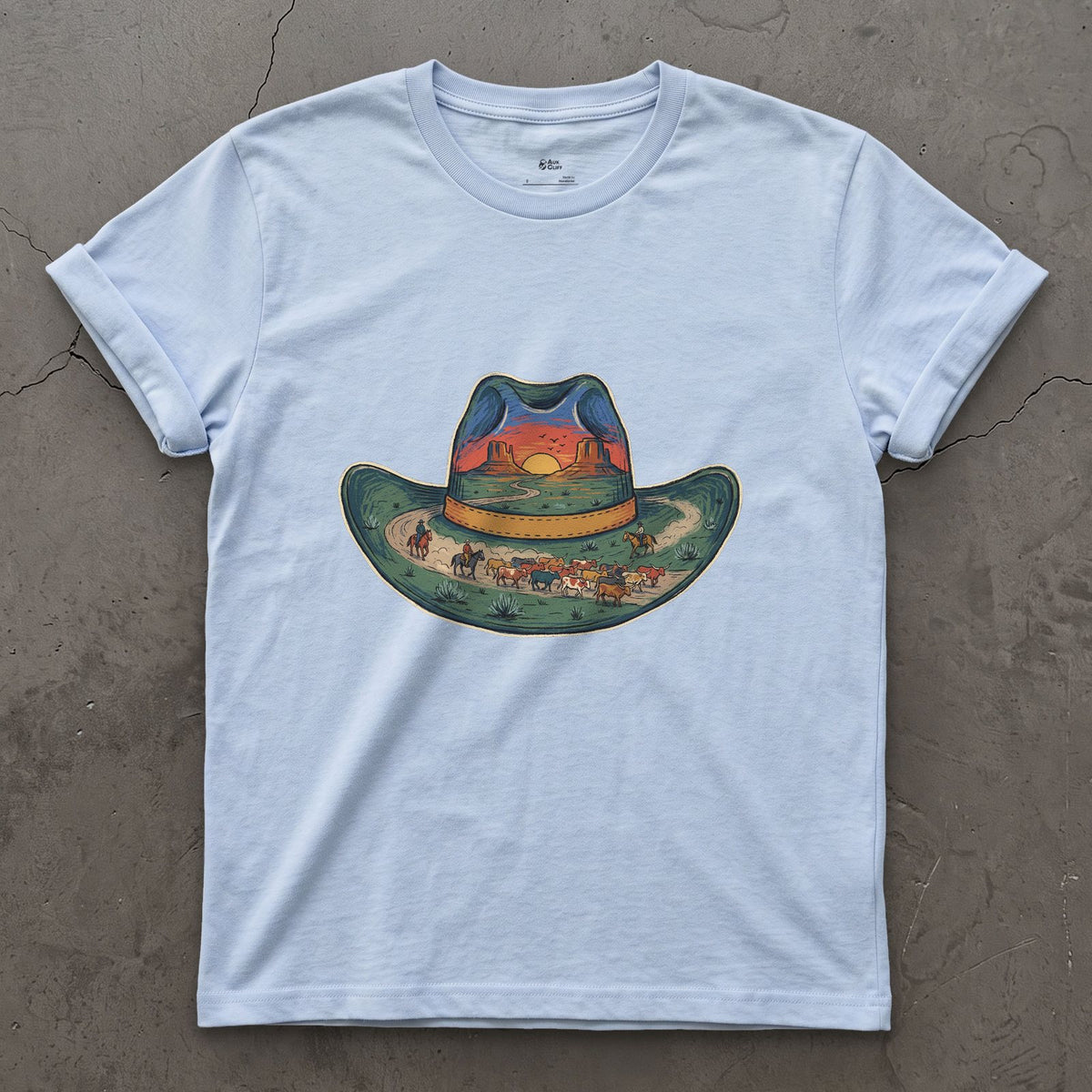 The Trail Home at Sunset, Cowboy Hat design on a Light Blue Gildan Softstyle t-shirt