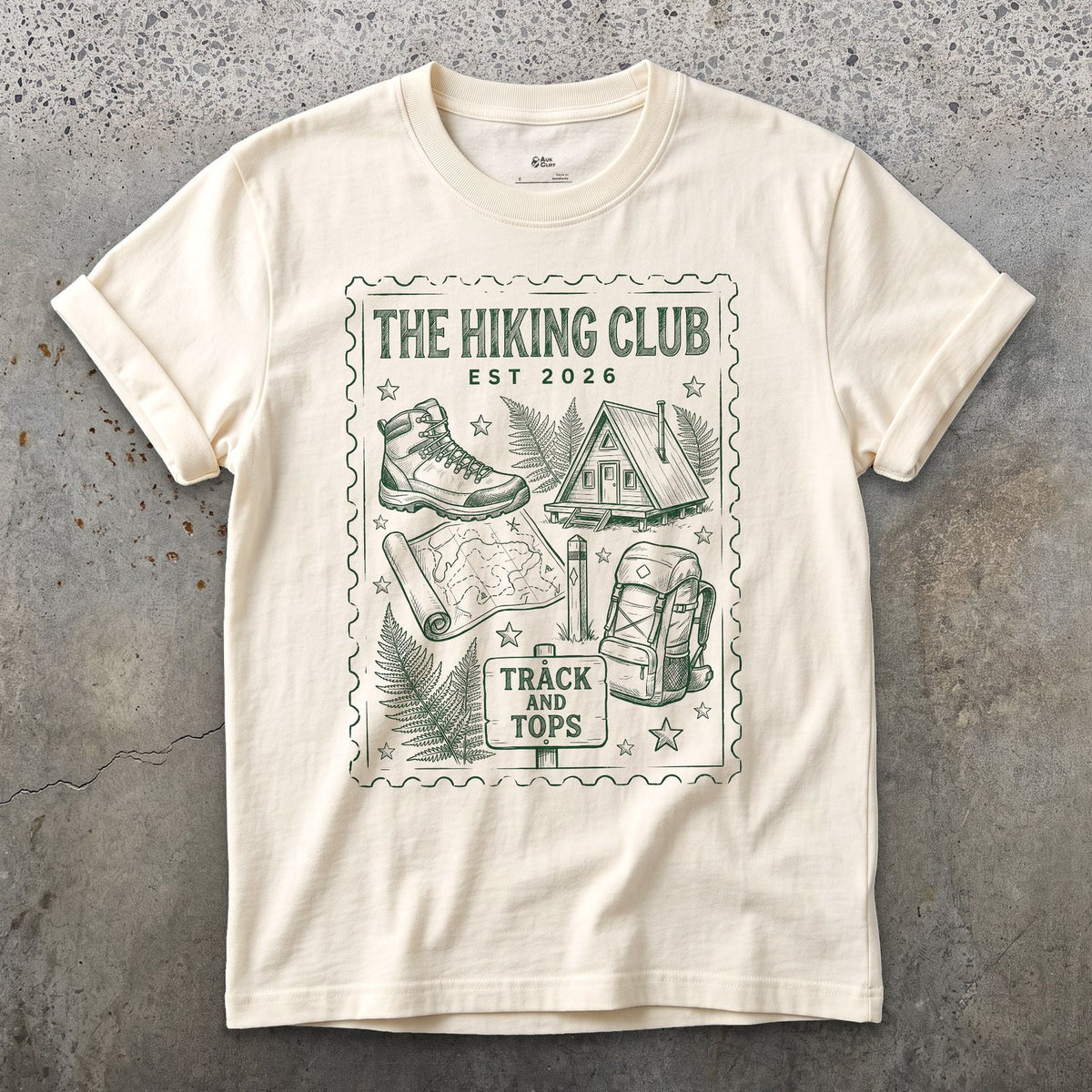 Track and Tops, Boot and Backpack design on a Natural Gildan Softstyle t-shirt