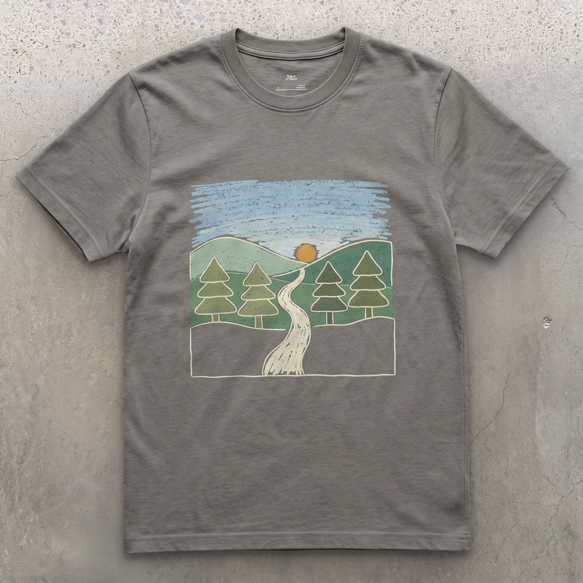 The Trail Before It Disappears Into Pines design on a Charcoal Gildan Softstyle t-shirt