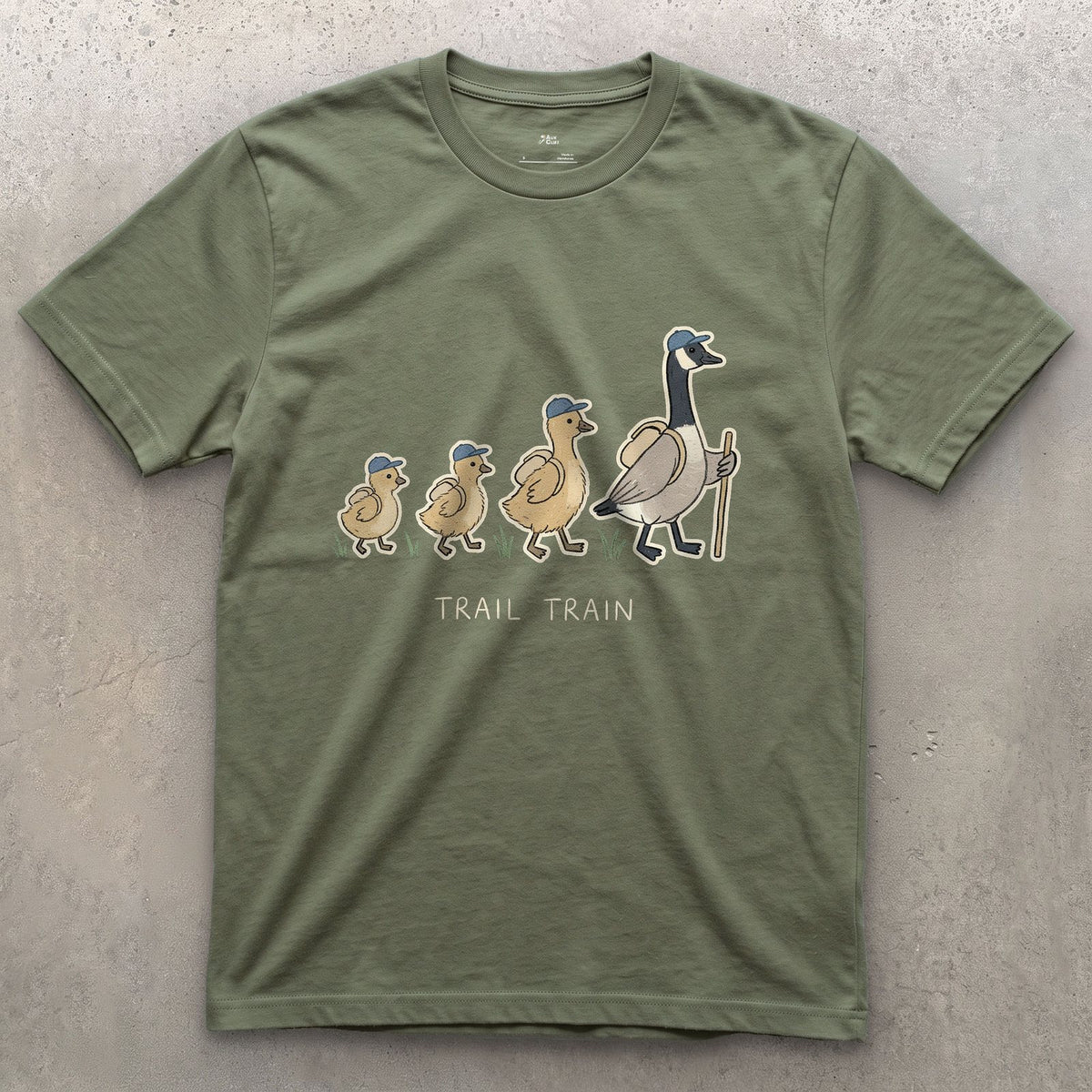 The Trail Train, Goose and Goslings design on a Military Green Gildan Softstyle t-shirt