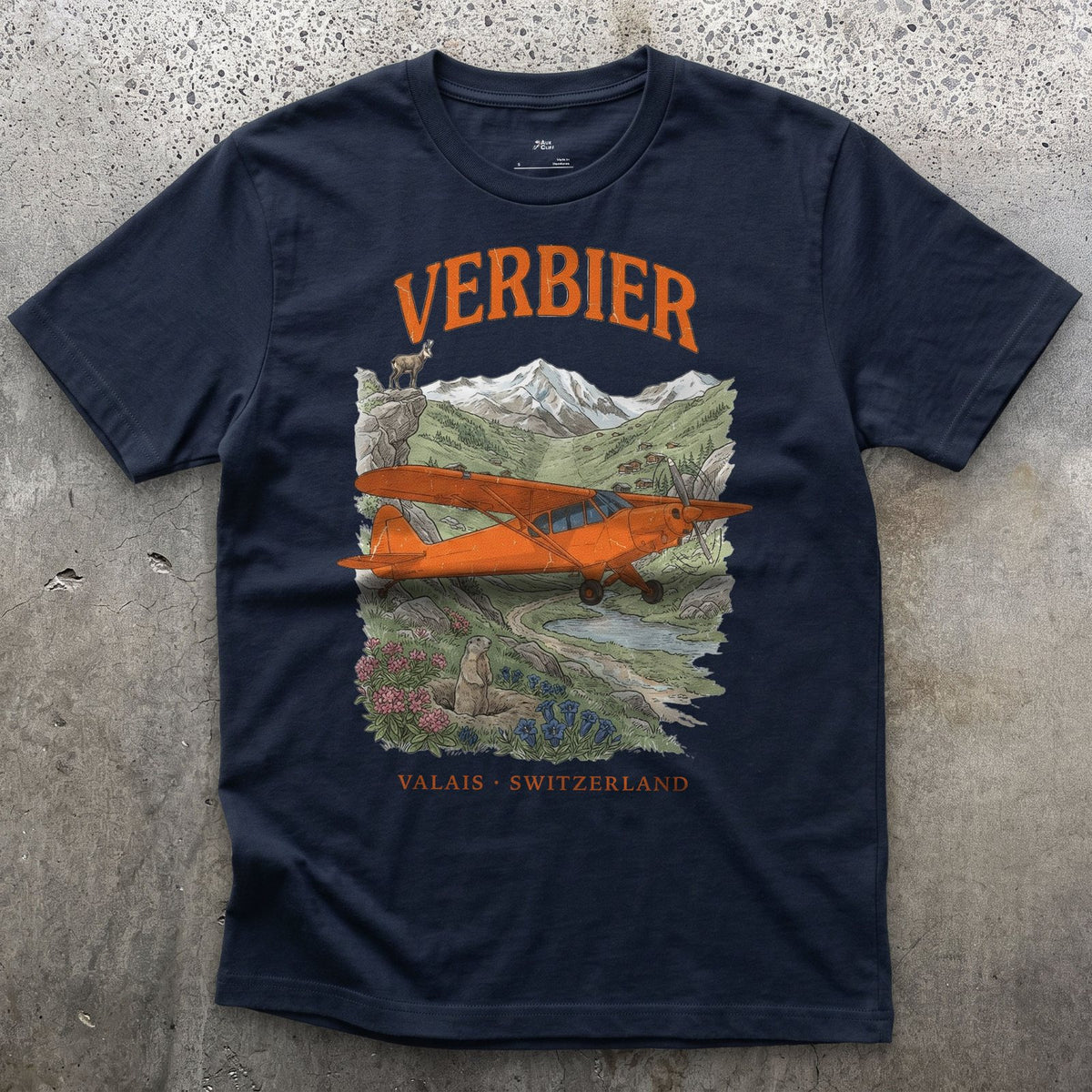 Verbier Bush Plane design on a Navy Gildan Softstyle t-shirt