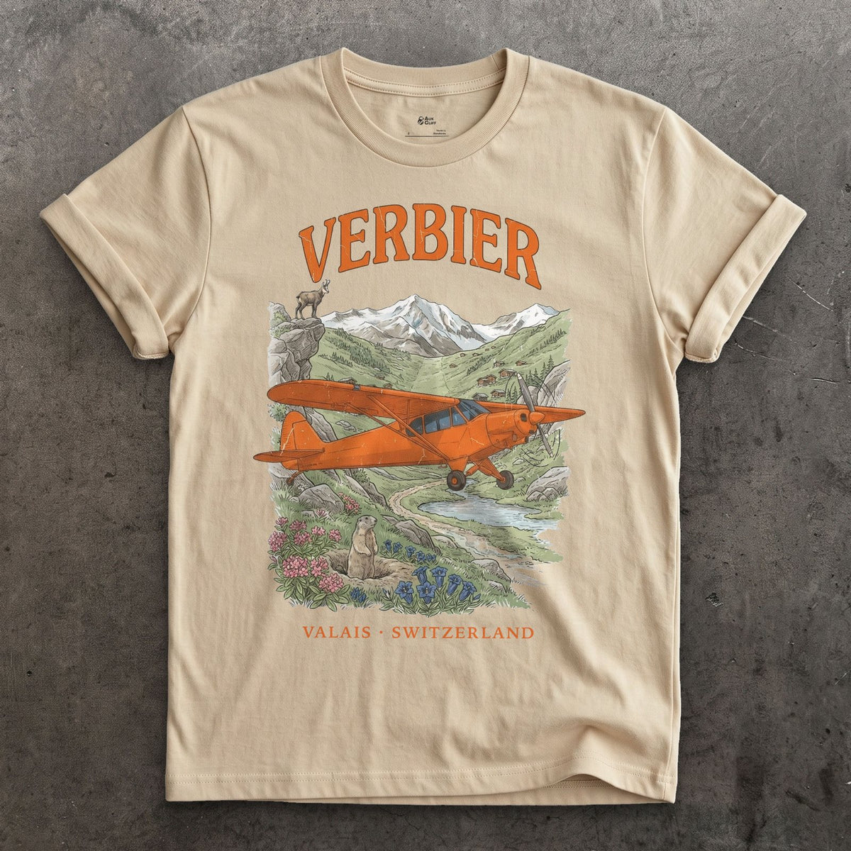 Verbier Bush Plane design on a Sand Gildan Softstyle t-shirt