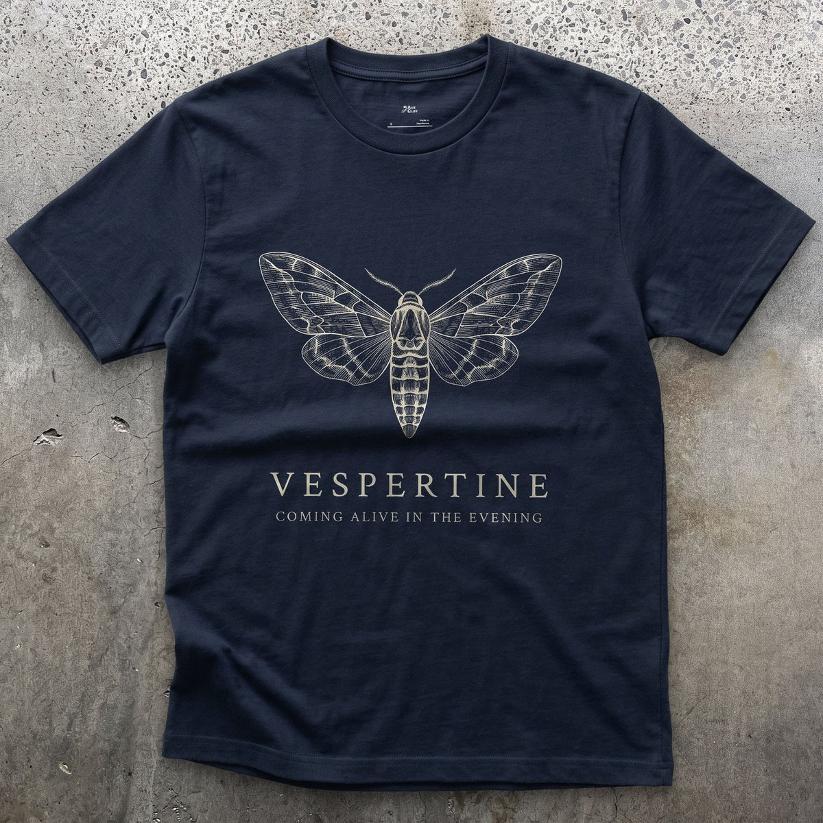 Vespertine design on a Navy Gildan Softstyle t-shirt