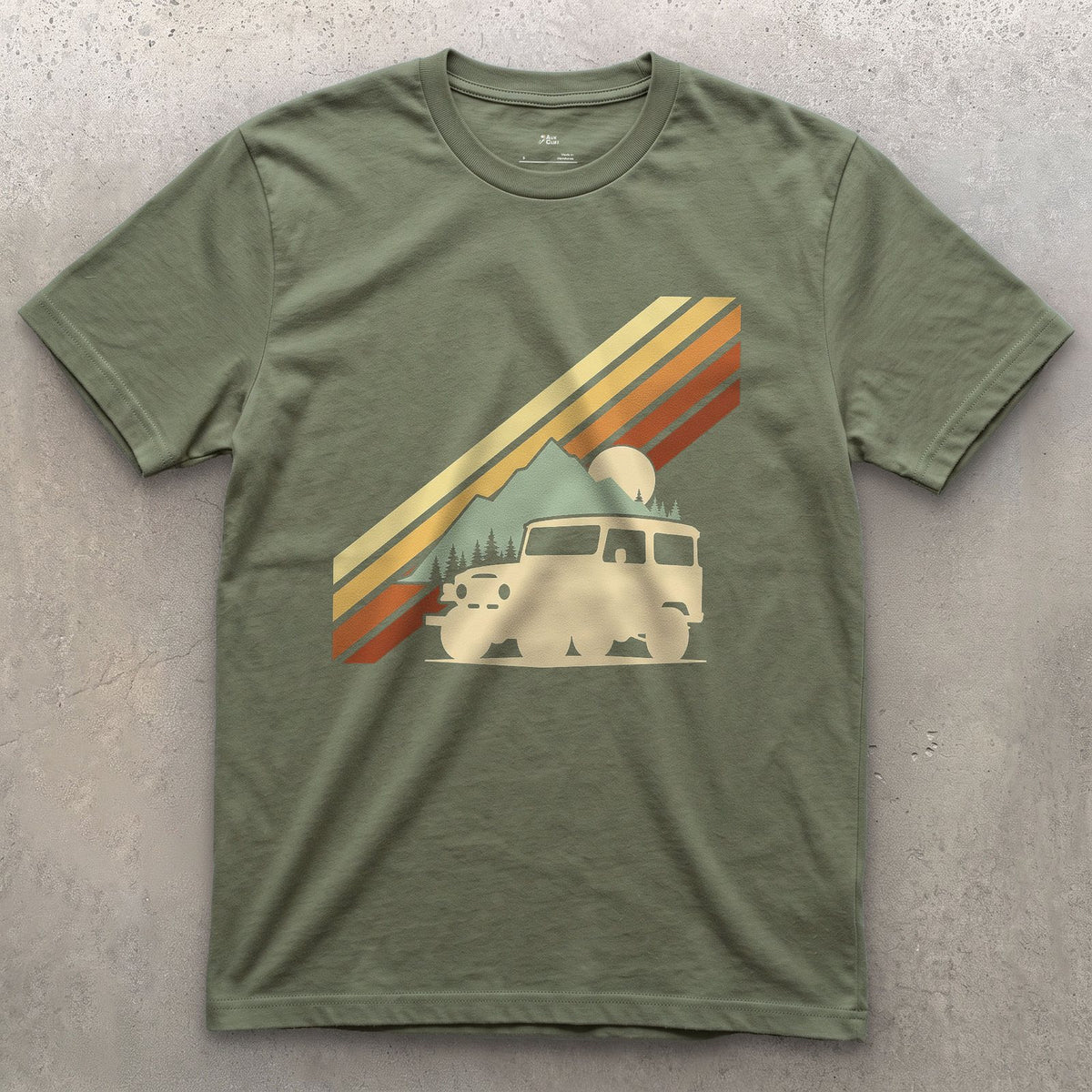 Low Sun Behind the Wagon and the Pines design on a Military Green Gildan Softstyle t-shirt