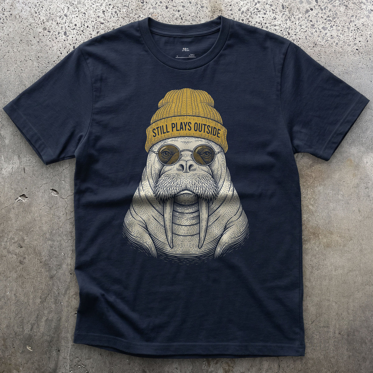 Still Plays Outside, Walrus in a Beanie design on a Navy Gildan Softstyle t-shirt