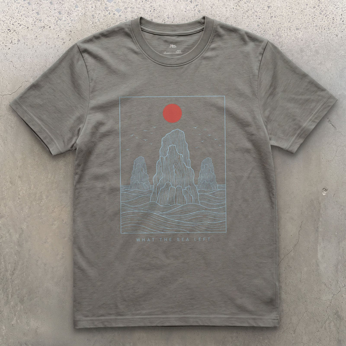 What the Sea Left, Stacks and Birds design on a Charcoal Gildan Softstyle t-shirt