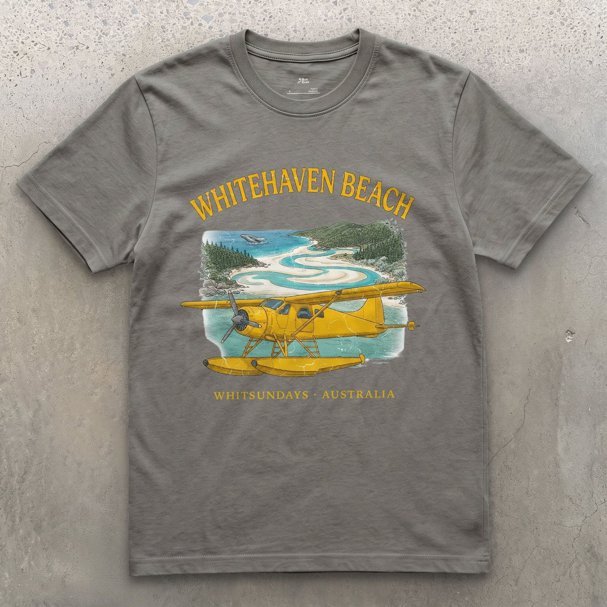 Whitehaven Beach Bush Plane design on a Charcoal Gildan Softstyle t-shirt