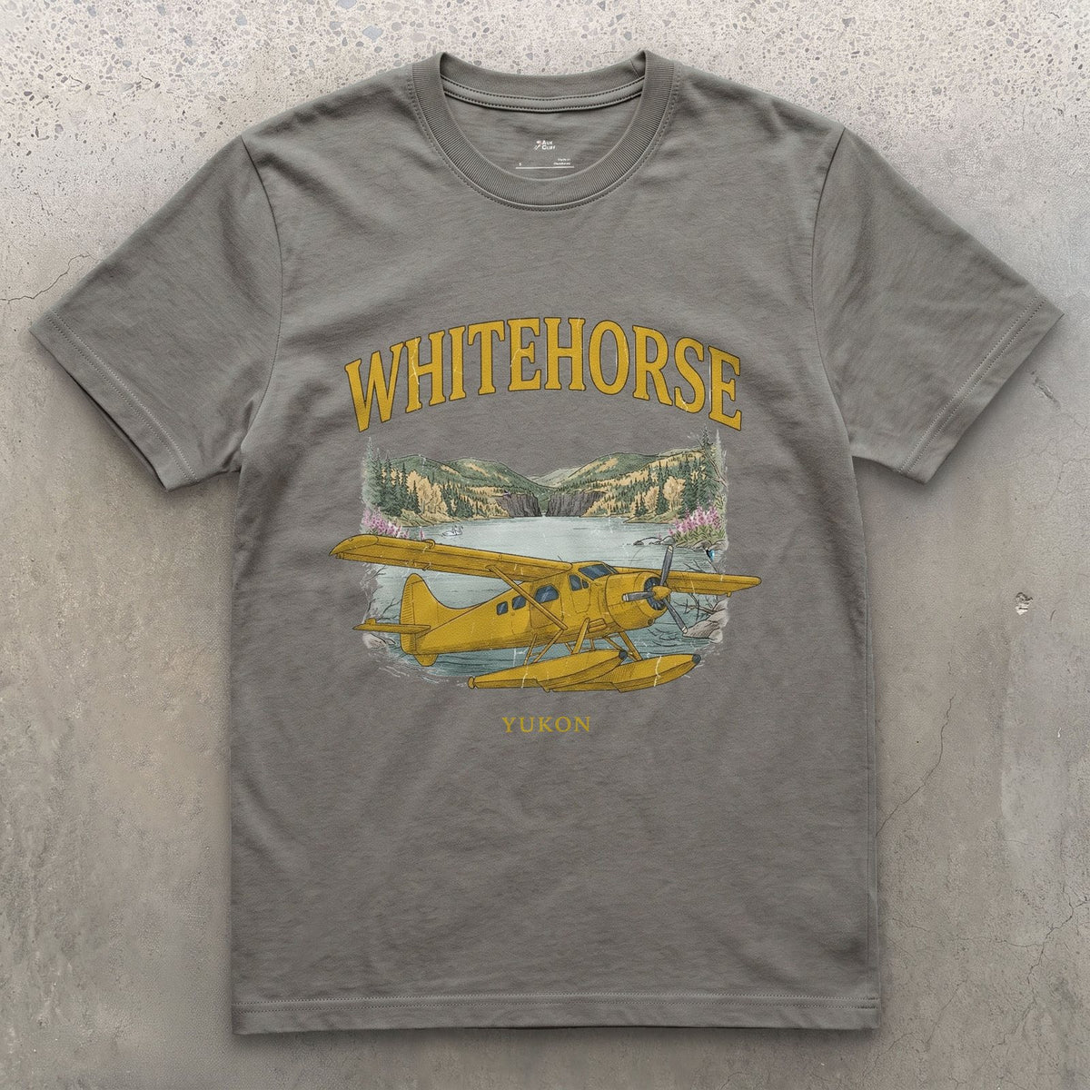 Whitehorse Bush Plane design on a Charcoal Gildan Softstyle t-shirt