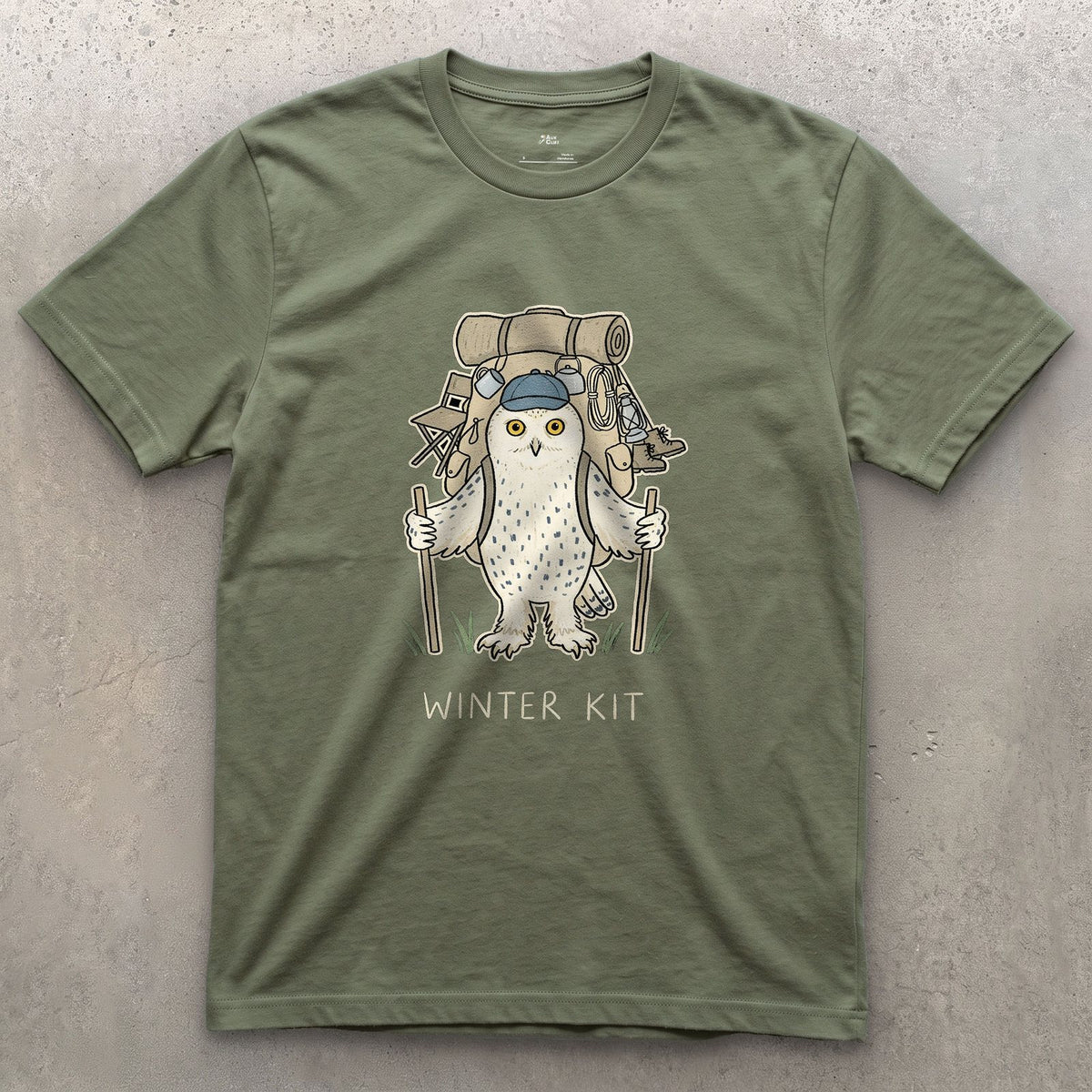 Winter Kit, Snowy Owl Hiker design on a Military Green Gildan Softstyle t-shirt