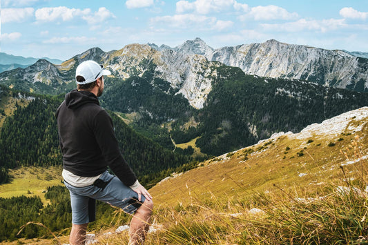 Hiker enjoying a scenic mountain view with a pack on their back