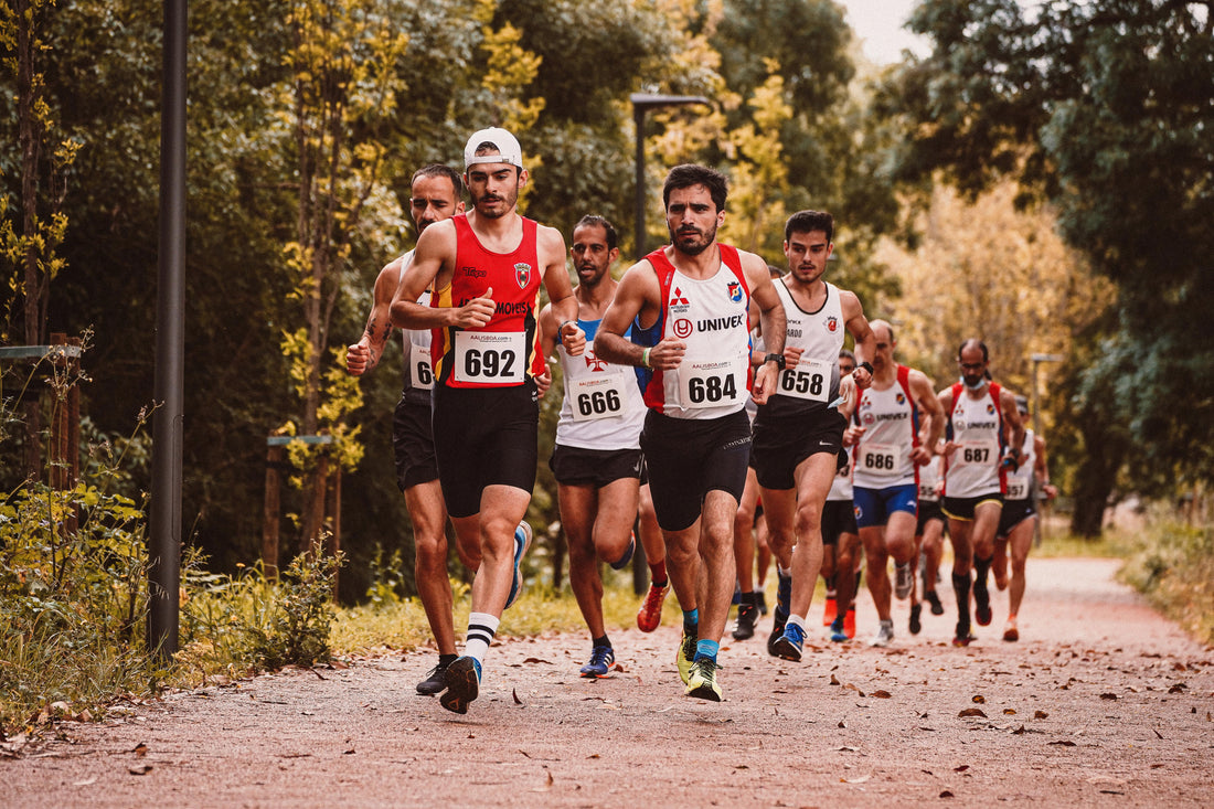 A dynamic scene of male athletes participating in an outdoor marathon race.