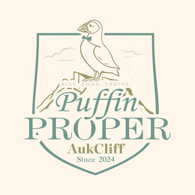 A puffin on a shield shaped crest above the words Puffin Proper