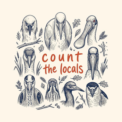 A grid of engraved seabird heads including a puffin and a gannet, around the handwritten words Count the Locals, printed on a natural cotton tee