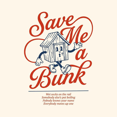 A camp cabin drawn as a running character in flowing script reading Save Me a Bunk, printed on a natural cotton tee