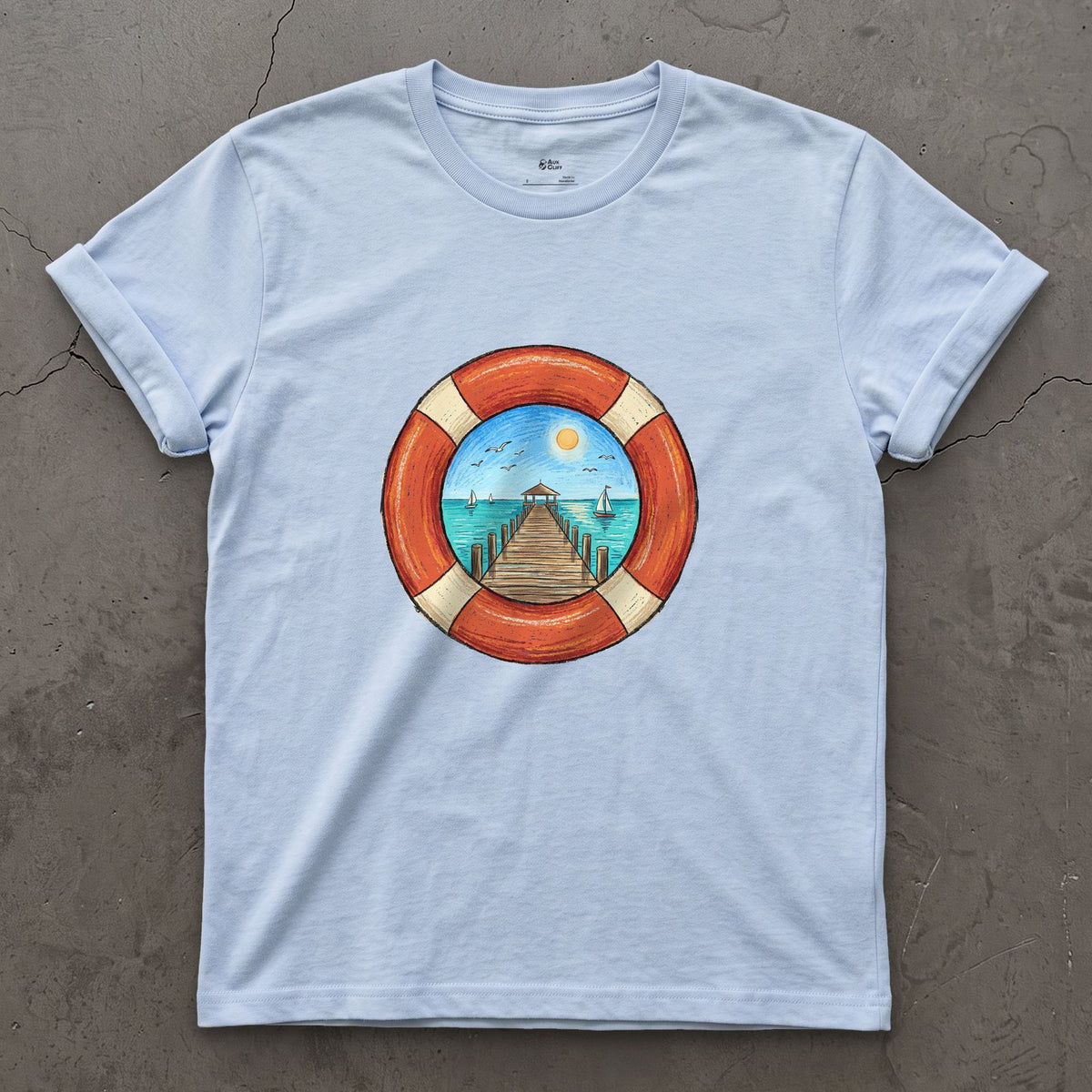 A Pier Through the Lifebuoy design on a Light Blue Gildan Softstyle t-shirt