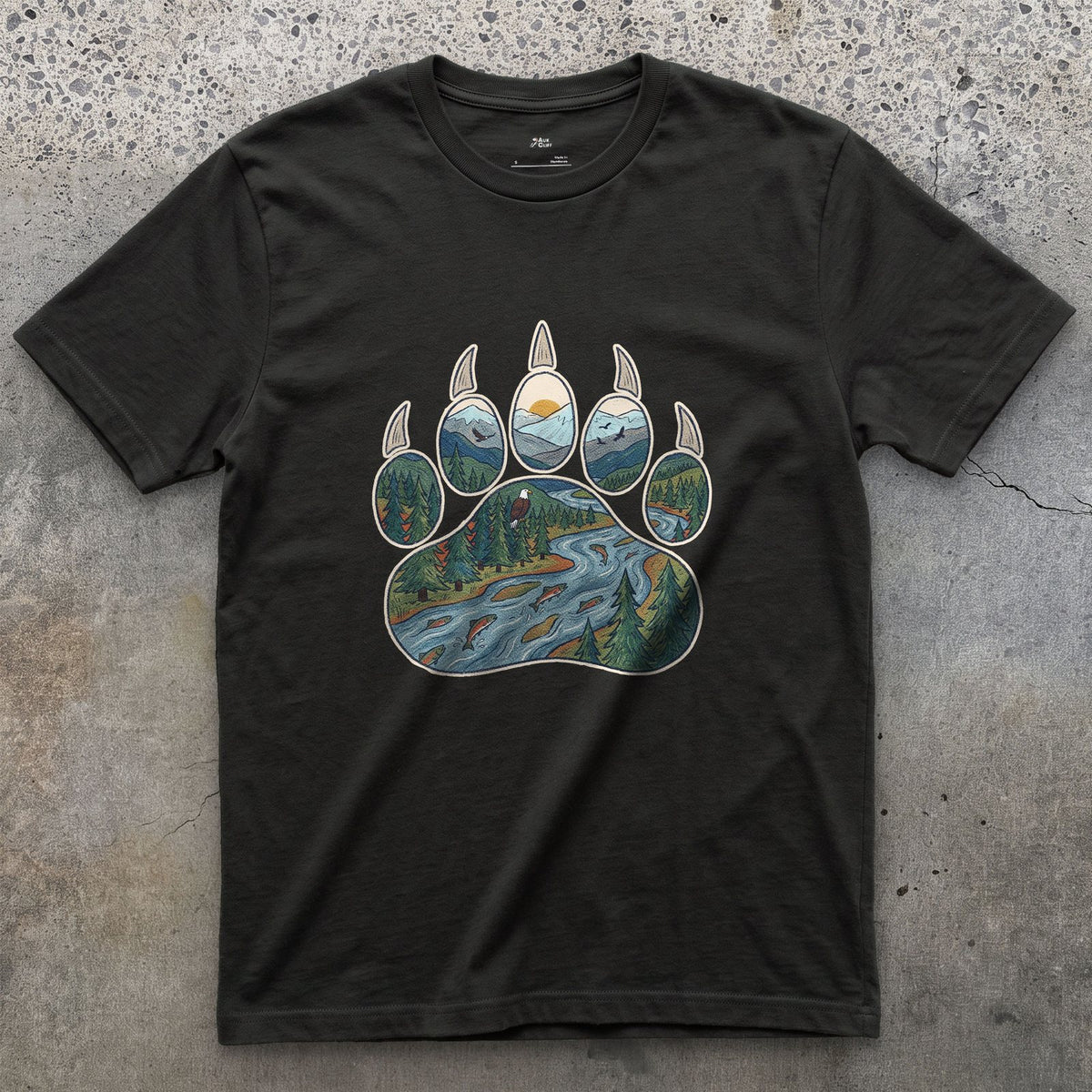 A Salmon River in the Paw Print design on a Black Gildan Softstyle t-shirt