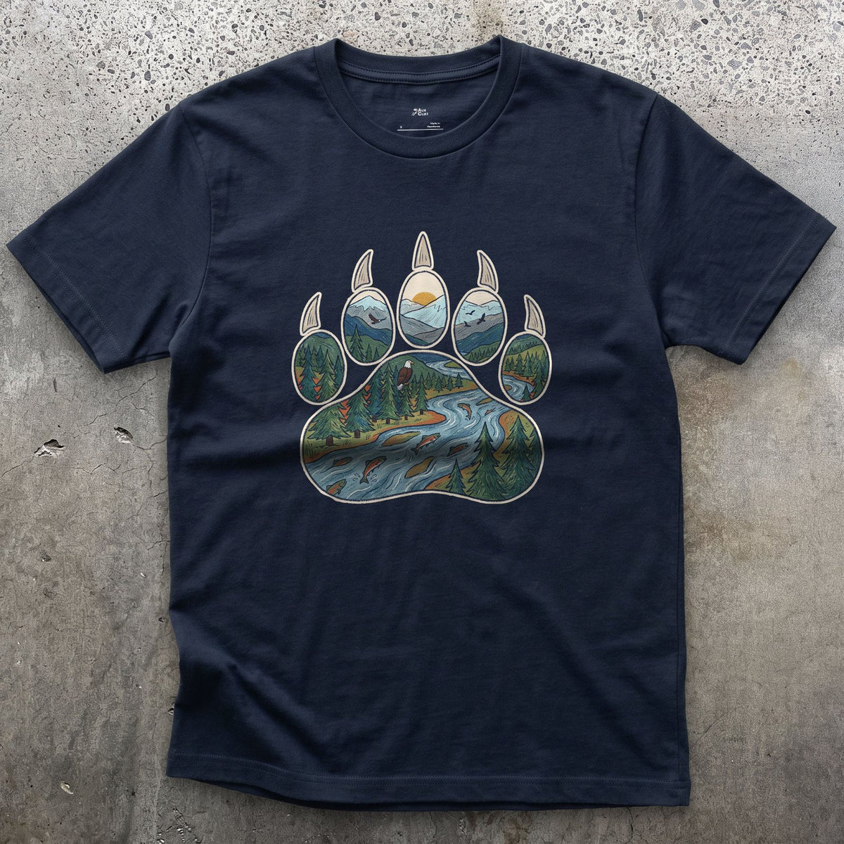 A Salmon River in the Paw Print design on a Navy Gildan Softstyle t-shirt