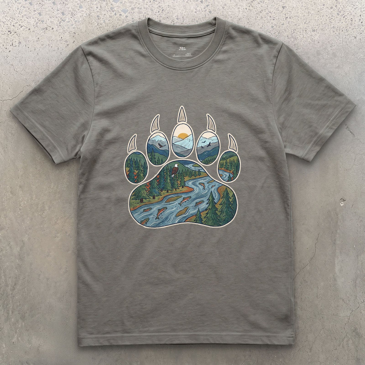A Salmon River in the Paw Print design on a Charcoal Gildan Softstyle t-shirt