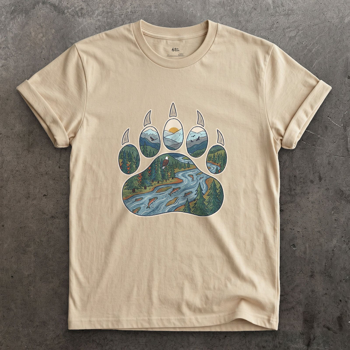A Salmon River in the Paw Print design on a Sand Gildan Softstyle t-shirt