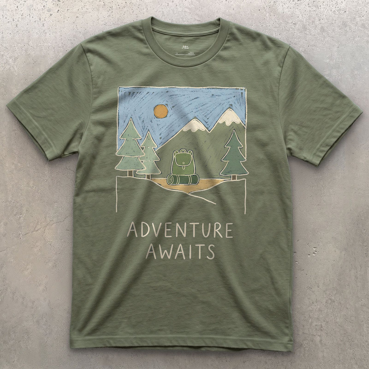 Adventure Awaits design on a Military Green Gildan Softstyle t-shirt