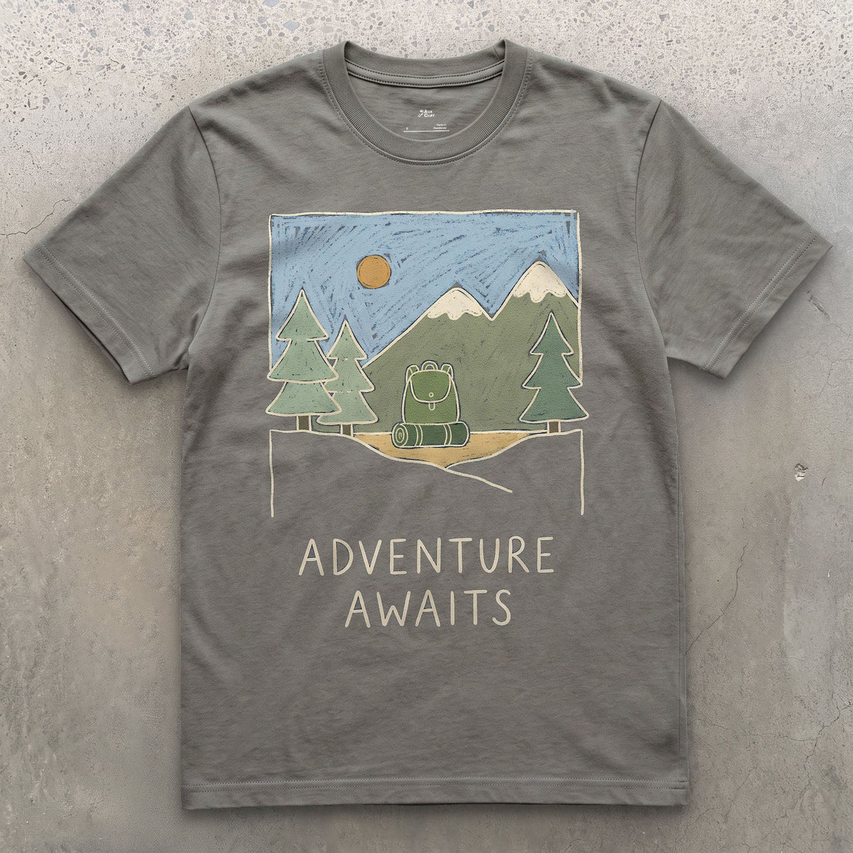 Adventure Awaits design on a Charcoal Gildan Softstyle t-shirt