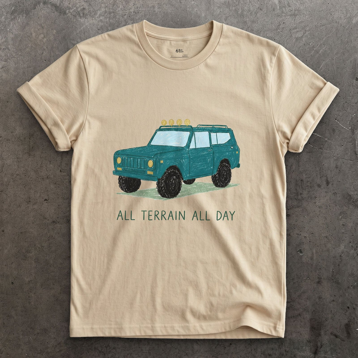 All Terrain All Day, Teal Wagon design on a Sand Gildan Softstyle t-shirt