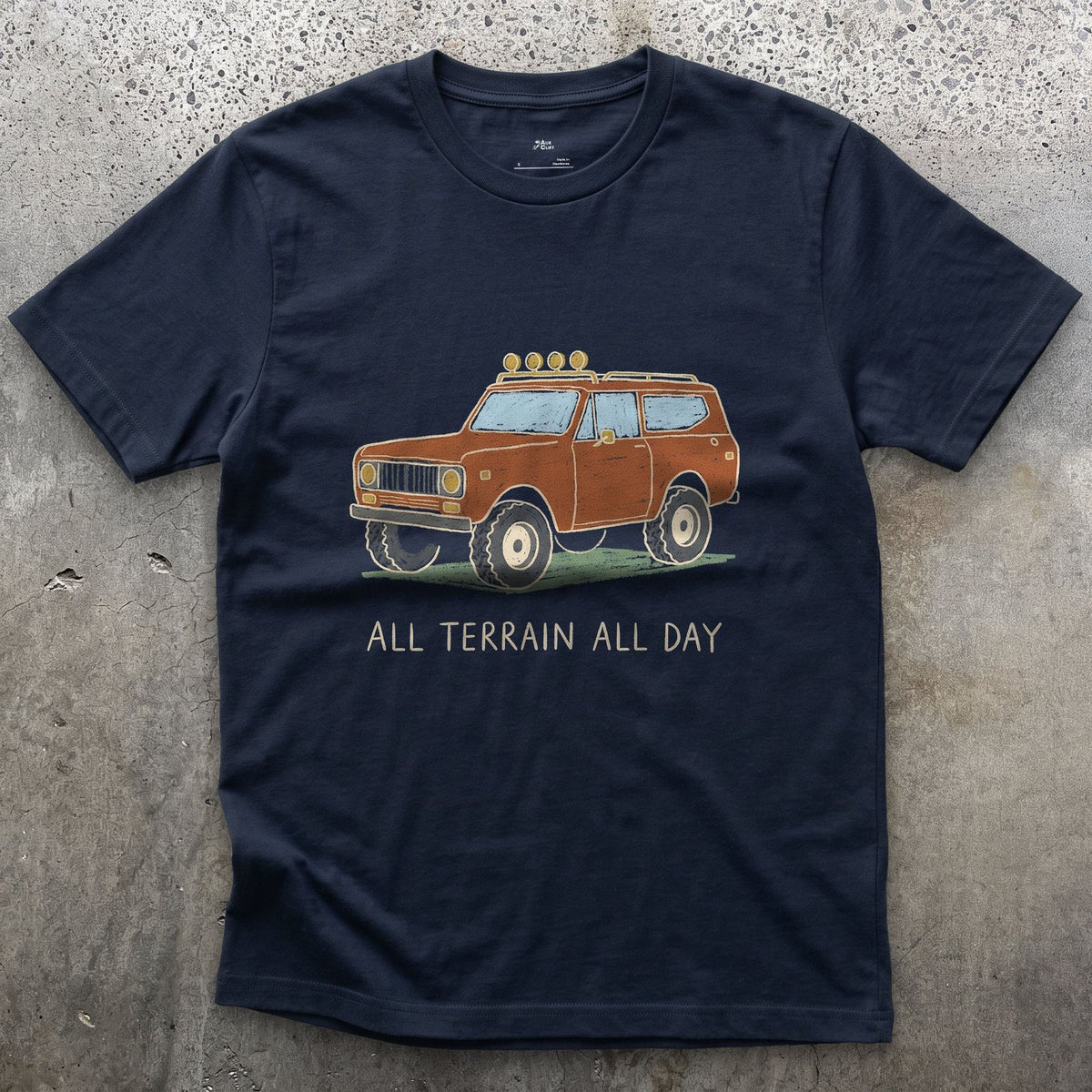 All Terrain All Day, Orange Wagon design on a Navy Gildan Softstyle t-shirt