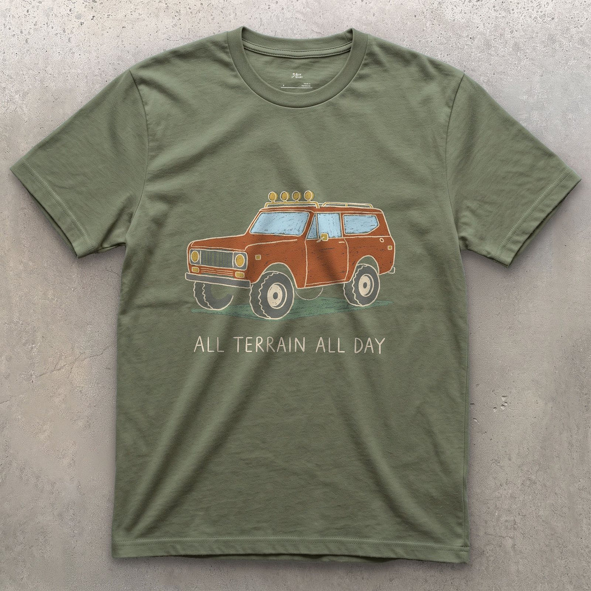 All Terrain All Day, Orange Wagon design on a Military Green Gildan Softstyle t-shirt
