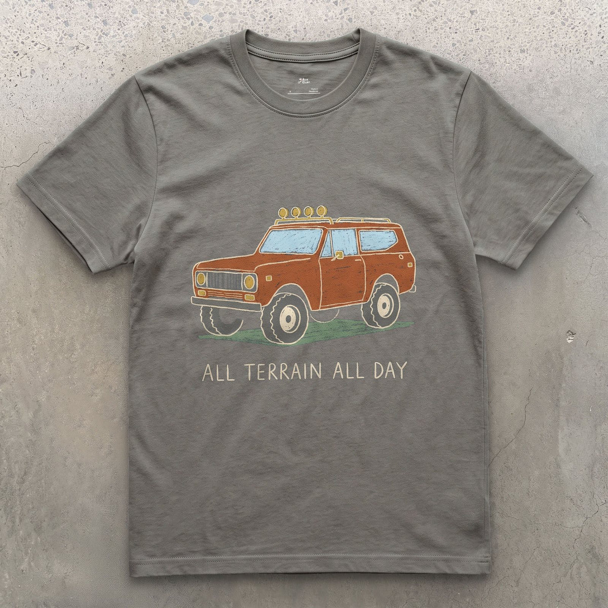 All Terrain All Day, Orange Wagon design on a Charcoal Gildan Softstyle t-shirt