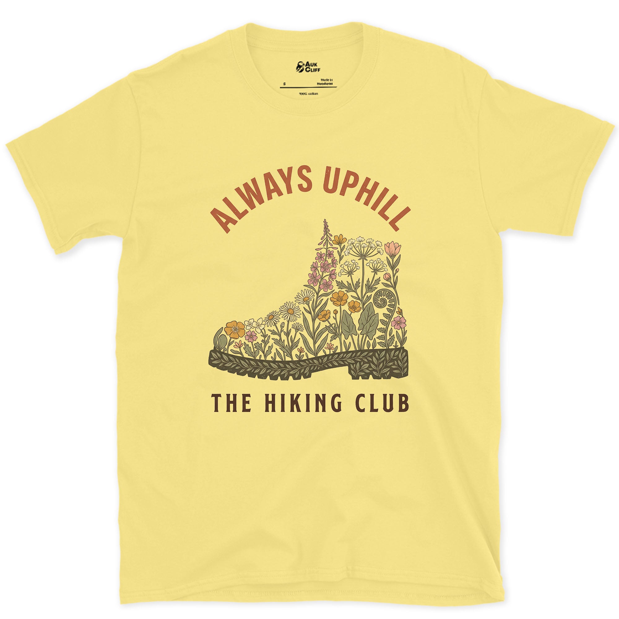 Always Uphill, Boot Full of Wildflowers design on a Cornsilk Gildan Softstyle t-shirt