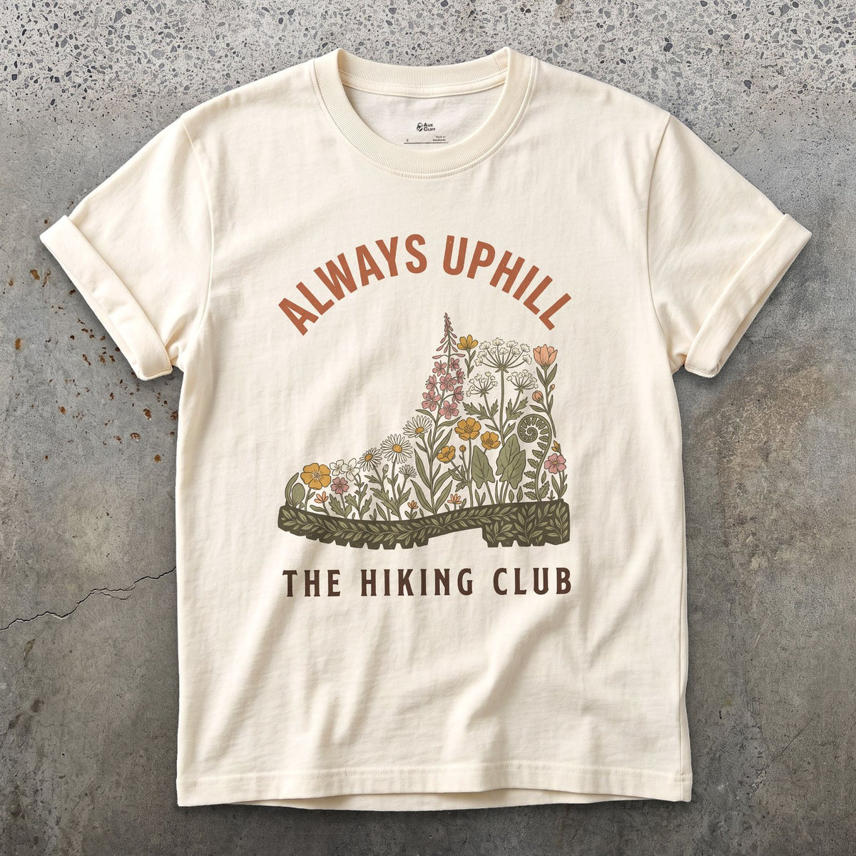 Always Uphill, Boot Full of Wildflowers design on a Natural Gildan Softstyle t-shirt