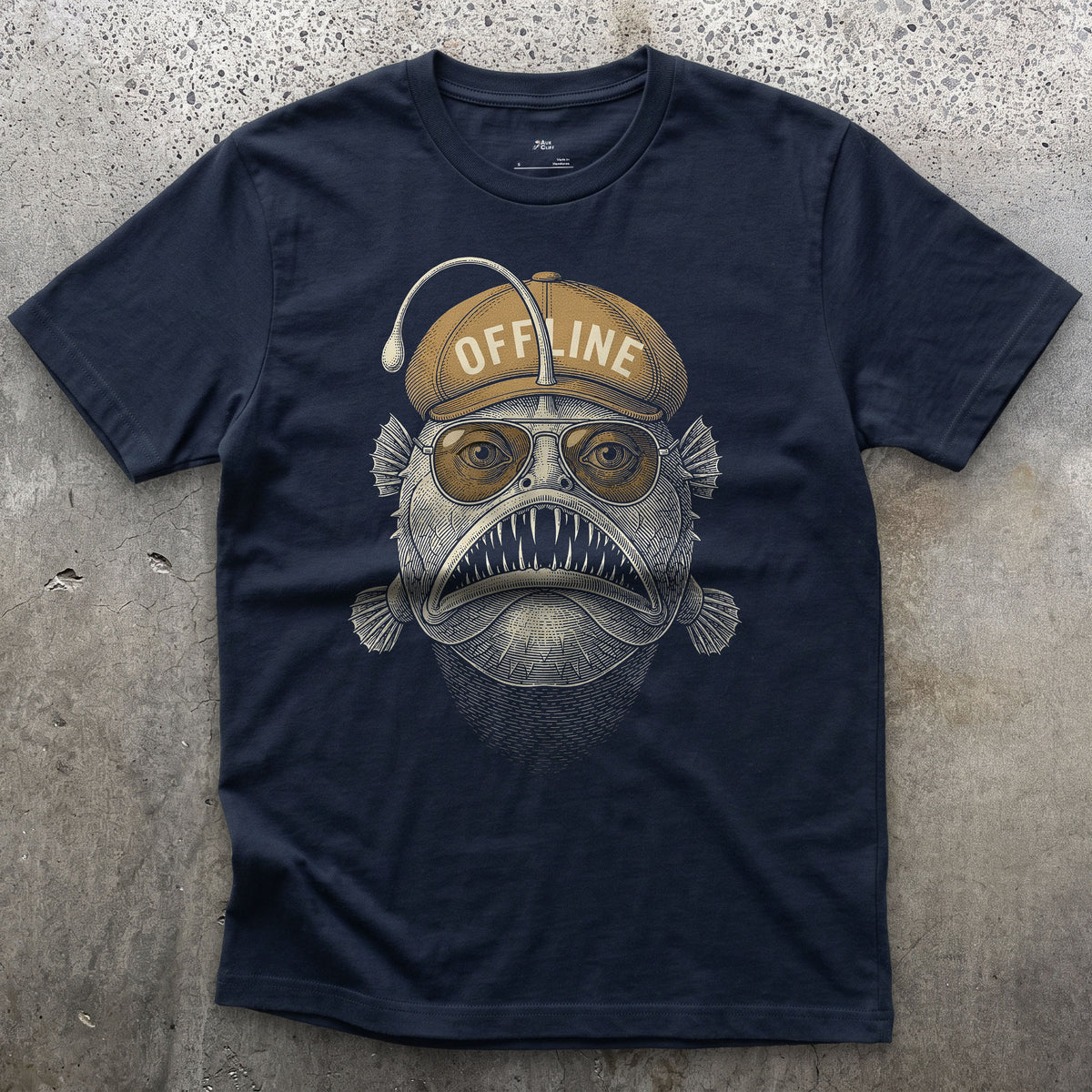 Offline, Deep Sea Anglerfish in a Flat Cap design on a Navy Gildan Softstyle t-shirt