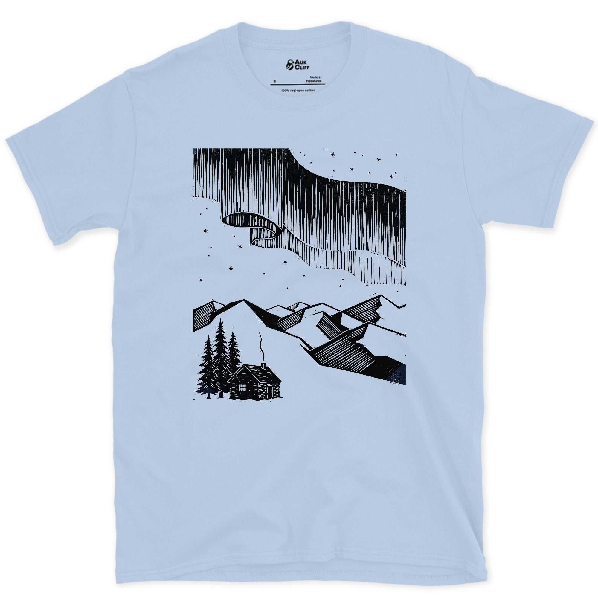 Stars Stacked Above a Small Cabin, Light design on a Light Blue Gildan Softstyle t-shirt