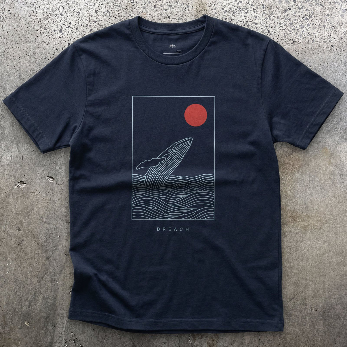 Breach, Whale Caught Mid-Arc design on a Navy Gildan Softstyle t-shirt