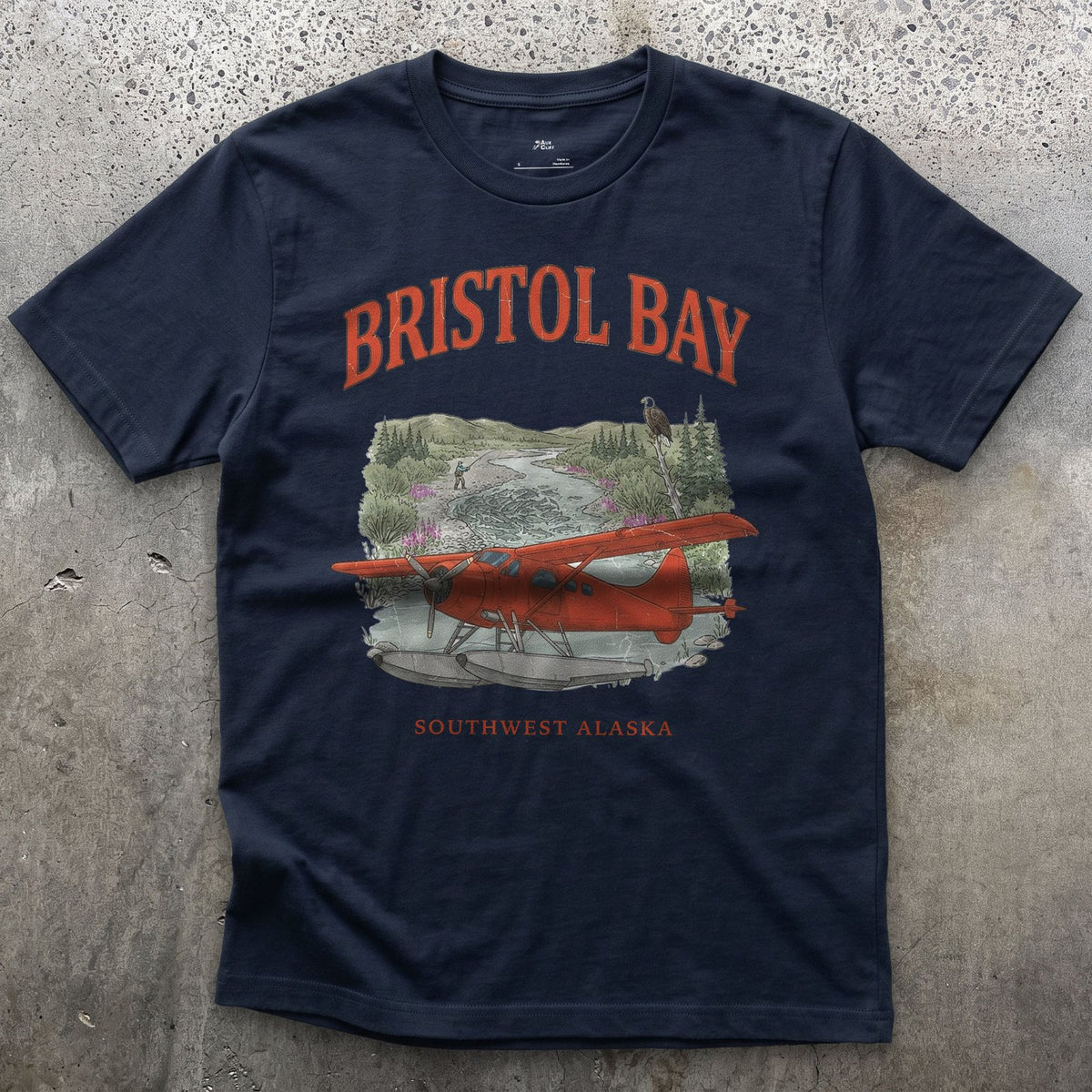 Bristol Bay Bush Plane design on a Navy Gildan Softstyle t-shirt