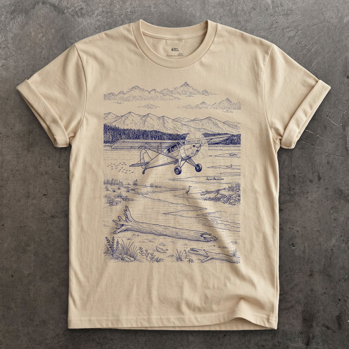 Bush Plane on the Tidal Flat design on a Sand Gildan Softstyle t-shirt