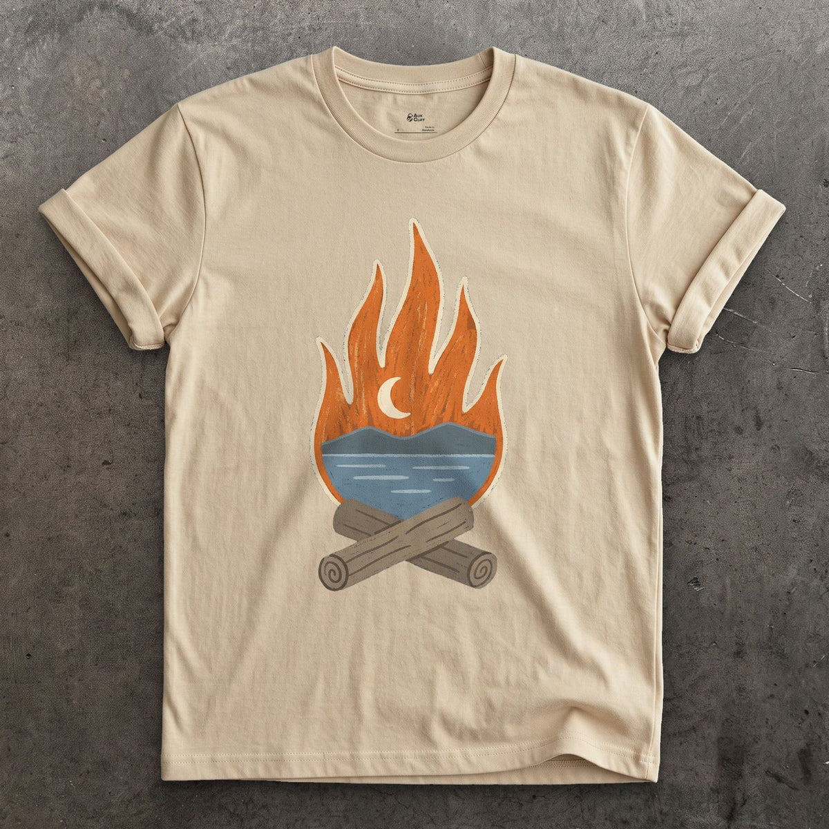 The Tarn Goes Quiet Under Firelight design on a Sand Gildan Softstyle t-shirt