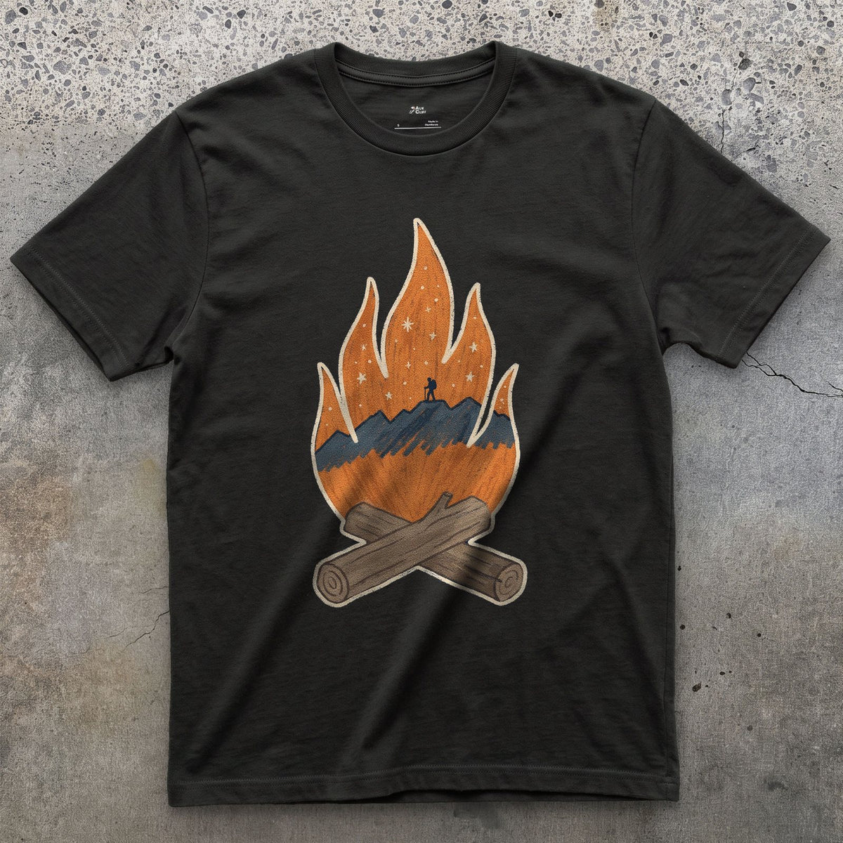 A Lone Hiker Held by Firelight design on a Black Gildan Softstyle t-shirt