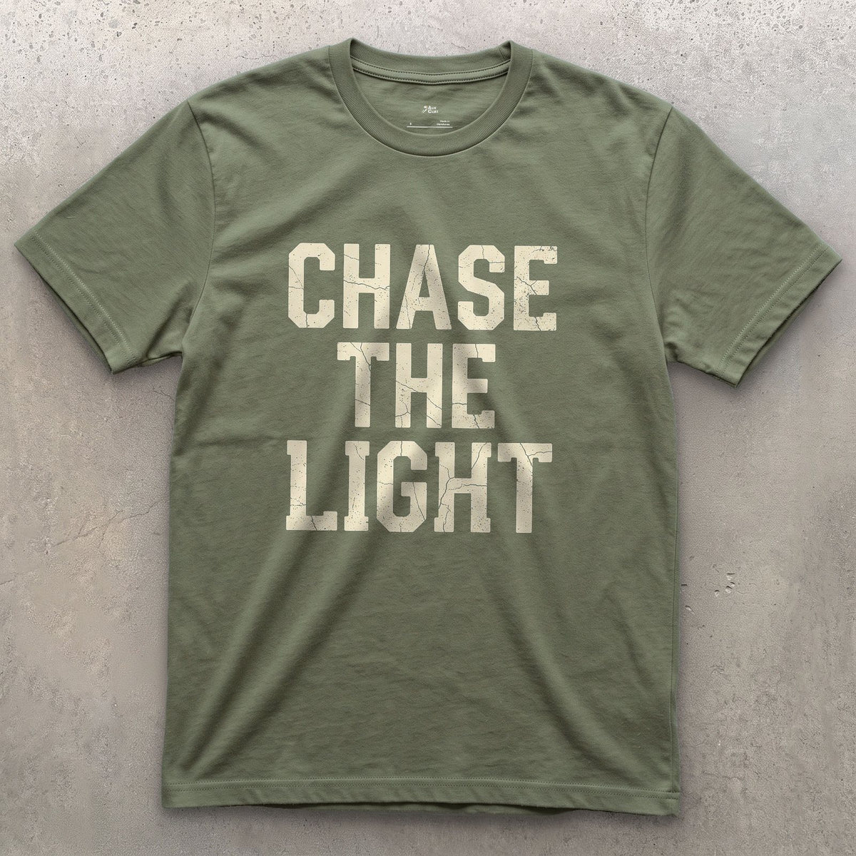 Chase the Light, Every Photographer Does design on a Military Green Gildan Softstyle t-shirt