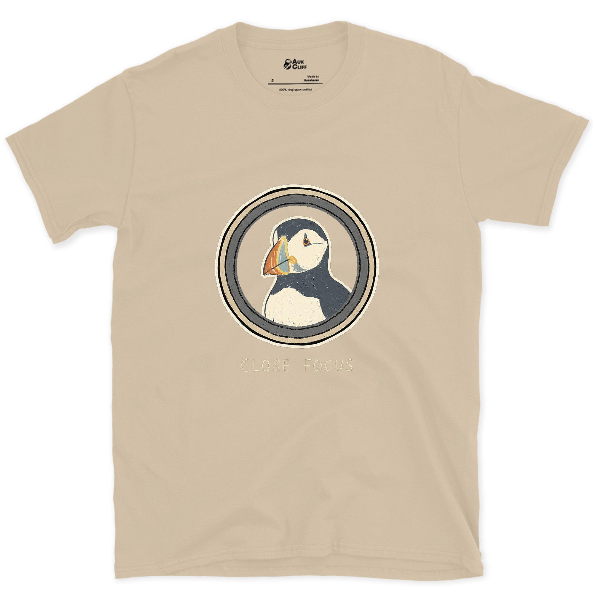 Close Focus on a Puffin design on a Sand Gildan Softstyle t-shirt