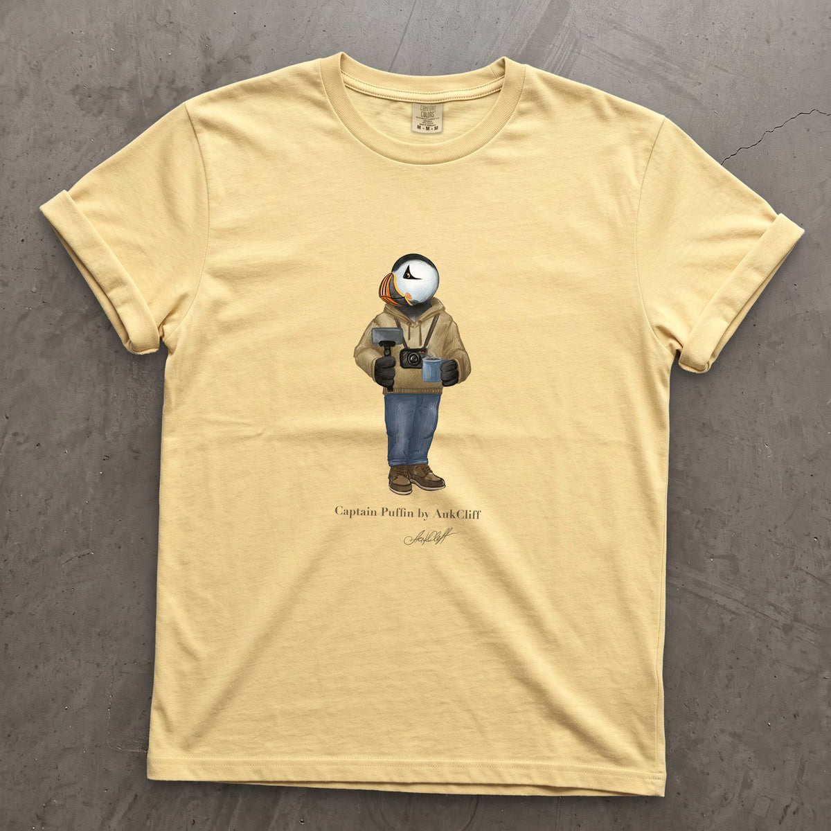 Captain Puffin Content Creator on a Butter Comfort Colors t-shirt