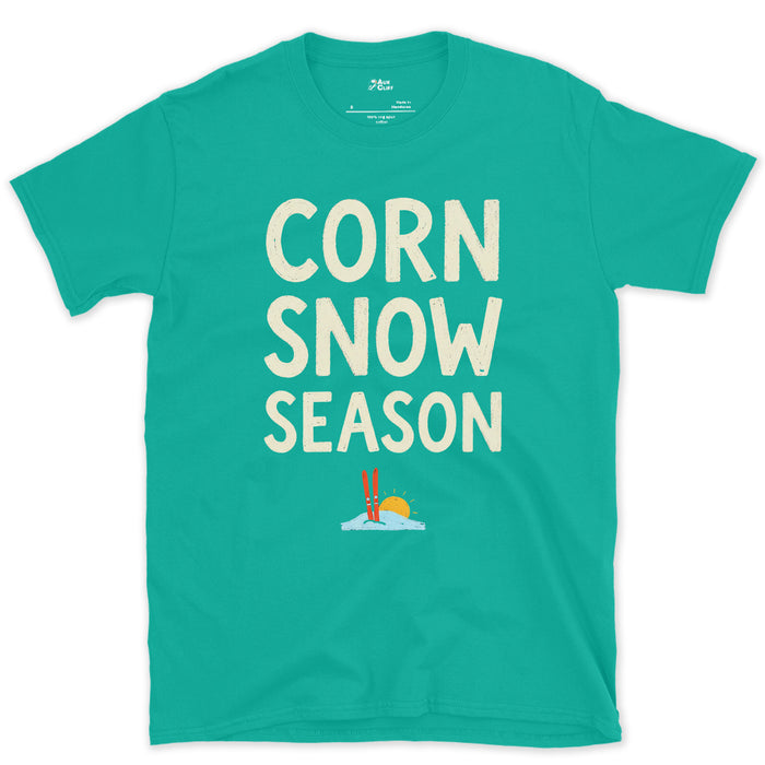 Corn Snow Season, Skis Under a Low Sun design on a Jade Dome Gildan Softstyle t-shirt