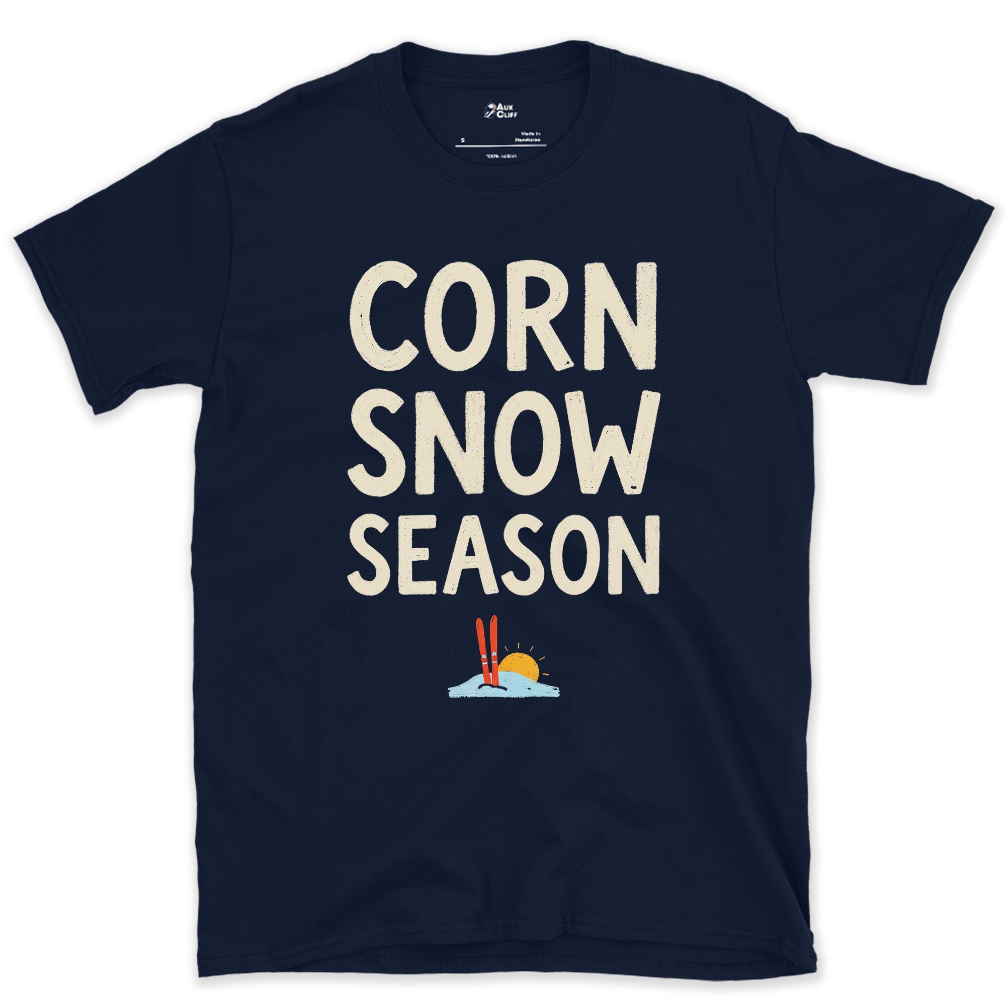 Corn Snow Season, Skis Under a Low Sun design on a Navy Gildan Softstyle t-shirt