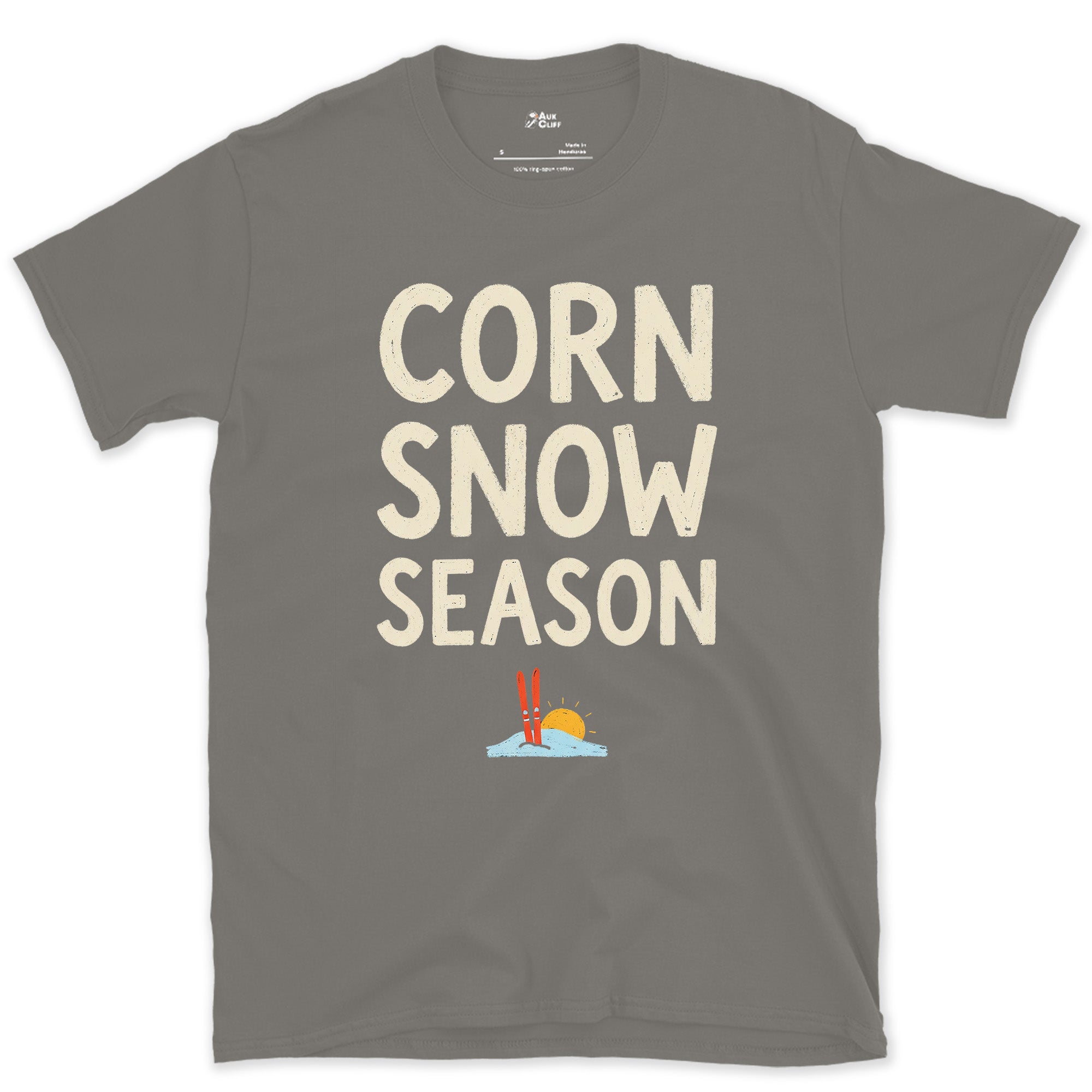 Corn Snow Season, Skis Under a Low Sun design on a Charcoal Gildan Softstyle t-shirt