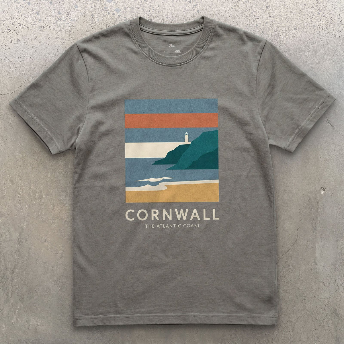 Lighthouse Above the Cornish Coast design on a Charcoal Gildan Softstyle t-shirt